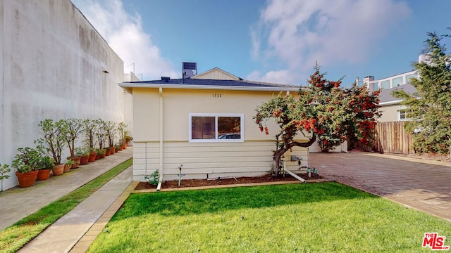 view of property exterior featuring a yard