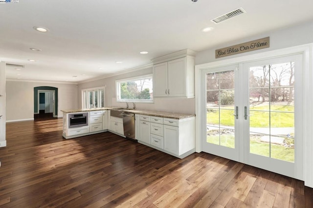 kitchen with white cabinetry, dark hardwood / wood-style floors, kitchen peninsula, and dishwasher