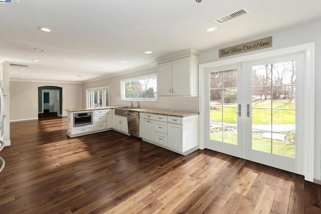 kitchen with white cabinetry, dark wood-type flooring, kitchen peninsula, and dishwasher