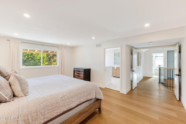 bedroom with light hardwood / wood-style floors