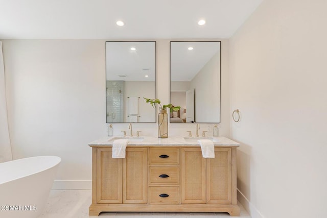 bathroom with vanity and separate shower and tub