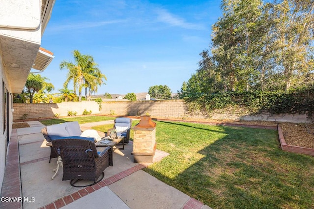 view of yard with an outdoor living space and a patio area