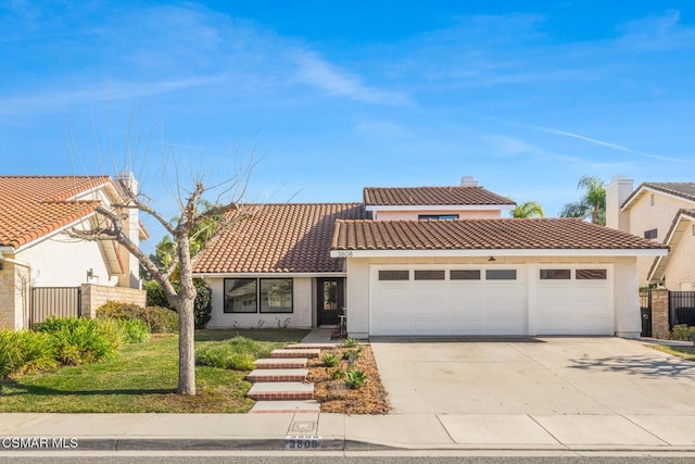 mediterranean / spanish house featuring a garage