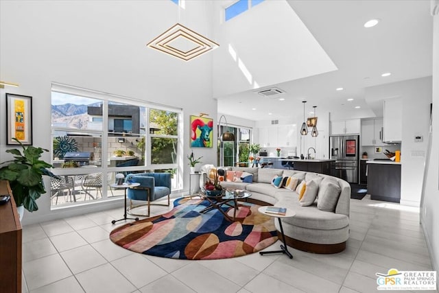 tiled living room with a towering ceiling