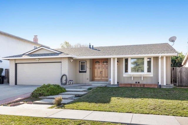 ranch-style home featuring a garage and a front yard