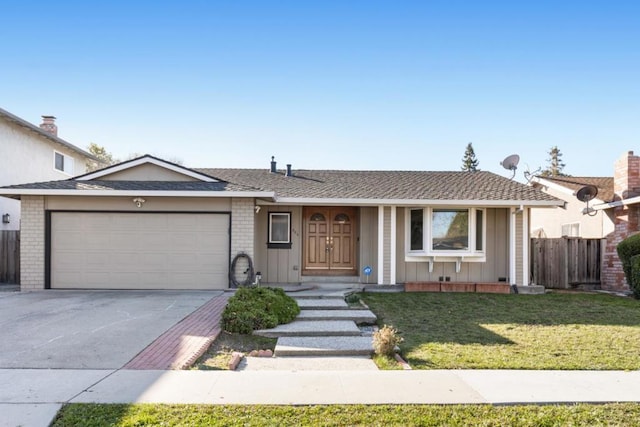 ranch-style house with a garage and a front yard