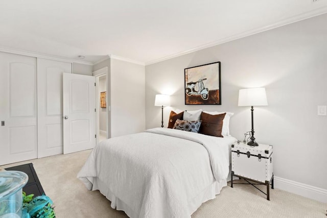 bedroom featuring light colored carpet, ornamental molding, and a closet