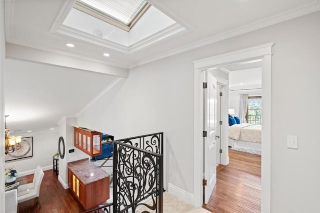 office area with dark wood-type flooring, ornamental molding, and a skylight