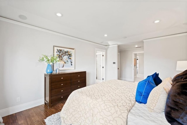 bedroom featuring ornamental molding and dark hardwood / wood-style flooring