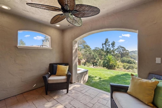 view of patio / terrace featuring ceiling fan