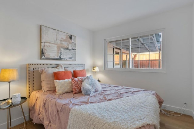 bedroom featuring wood-type flooring