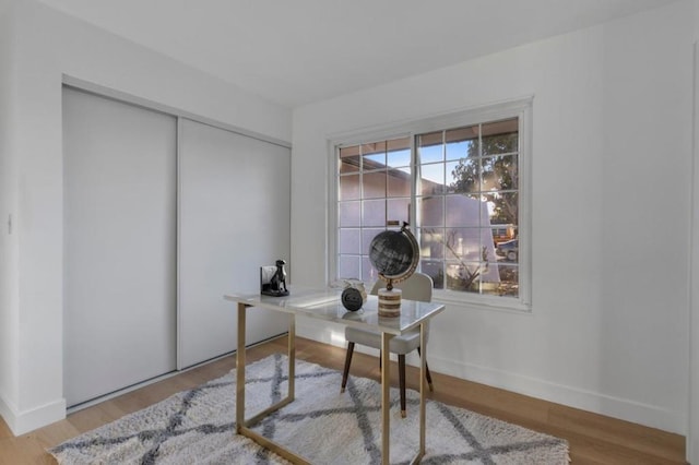 office with light hardwood / wood-style floors