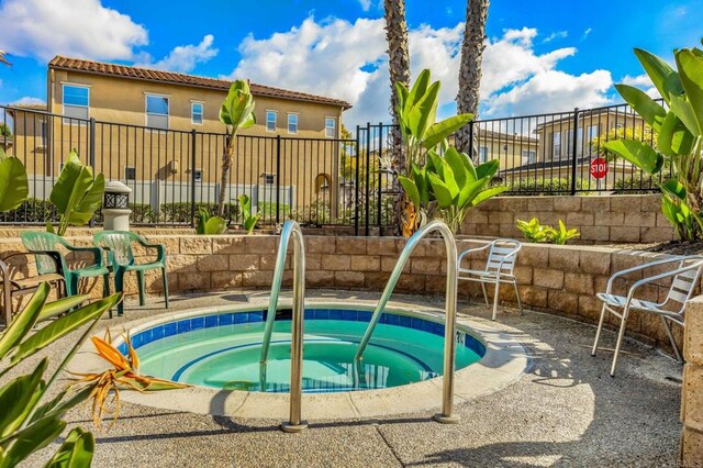 view of pool featuring a community hot tub