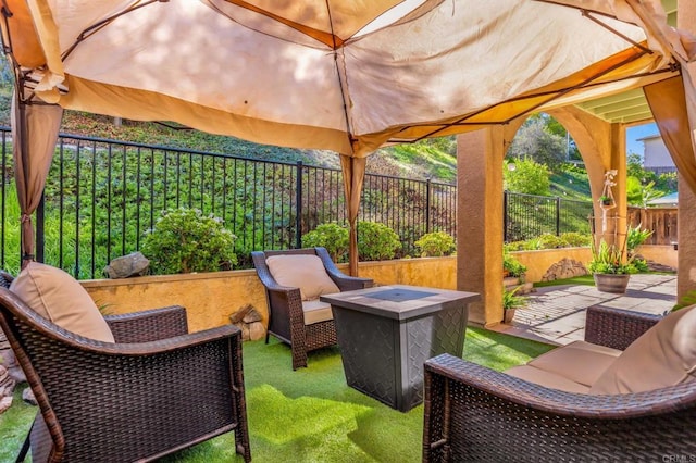 view of patio featuring a fire pit