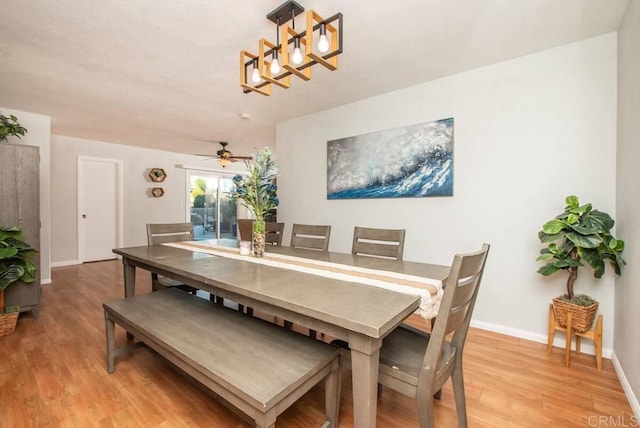 dining area featuring hardwood / wood-style flooring and ceiling fan