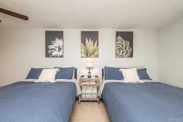 bedroom featuring ceiling fan and light carpet