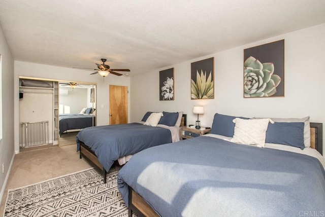 bedroom with a closet, ceiling fan, and carpet