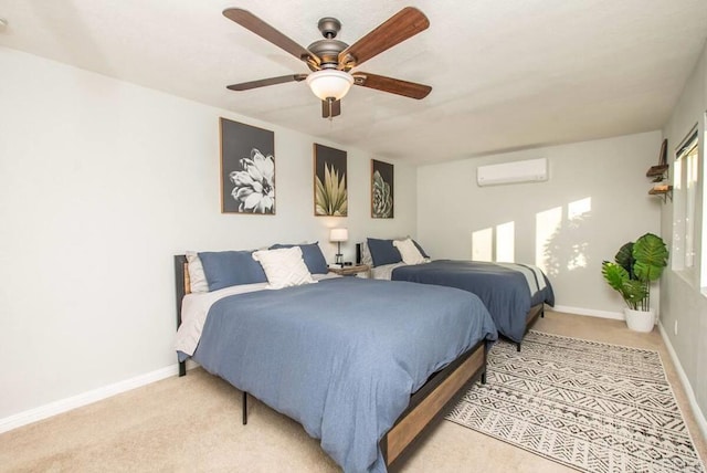 bedroom with ceiling fan, light carpet, and a wall unit AC