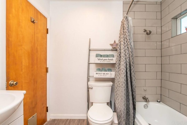 full bathroom featuring vanity, wood-type flooring, toilet, and shower / tub combo with curtain