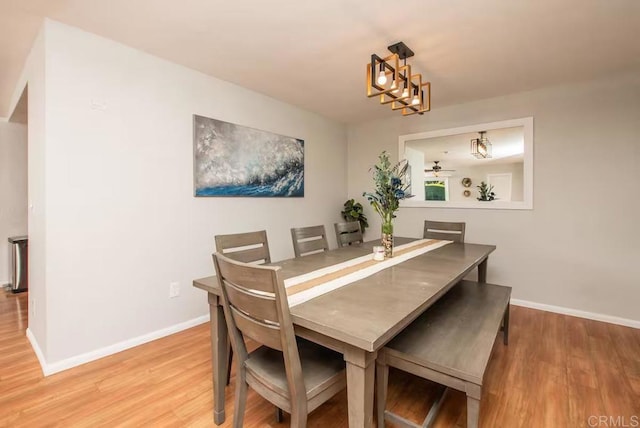 dining space with light hardwood / wood-style floors