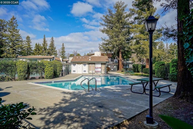 view of pool featuring a patio area