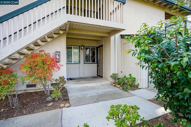 property entrance with a balcony