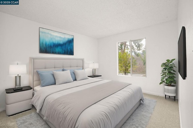 bedroom featuring light carpet and a textured ceiling