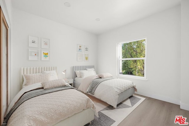 bedroom featuring light wood-type flooring