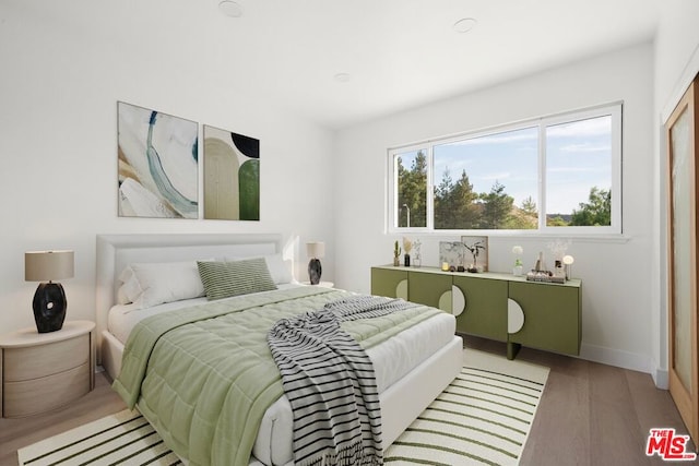 bedroom featuring hardwood / wood-style flooring