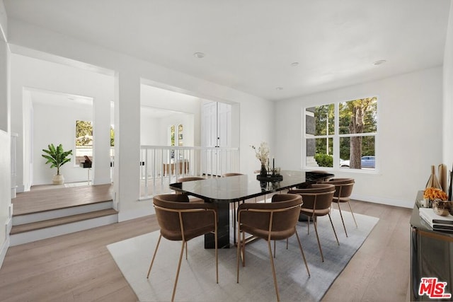 dining area featuring light wood-type flooring