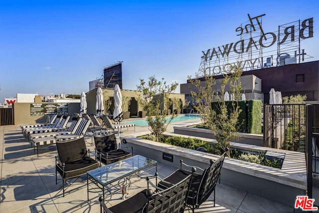 view of patio with a community pool