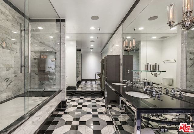 full bathroom featuring vanity, combined bath / shower with glass door, and toilet