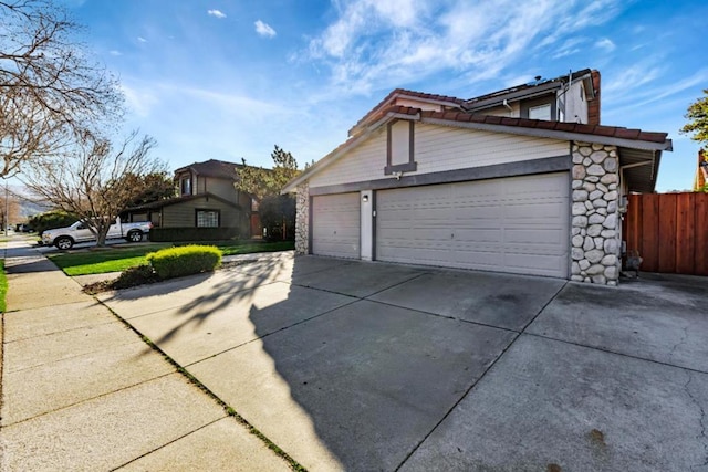 view of side of property featuring a garage