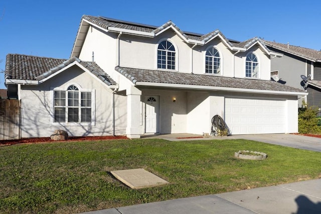 front facade featuring a garage and a front lawn