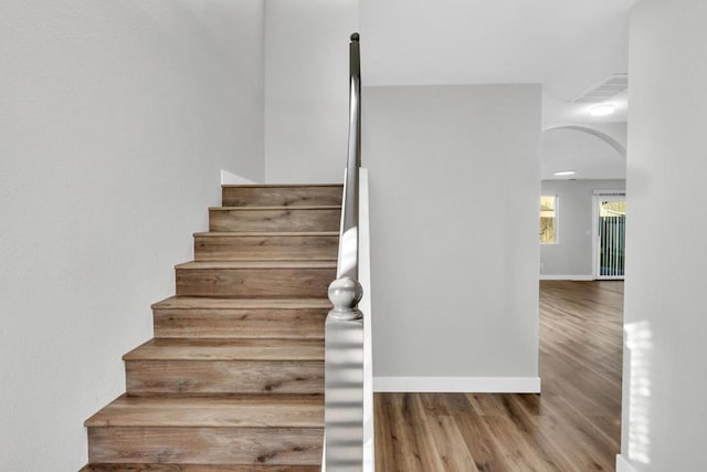 stairway with wood-type flooring