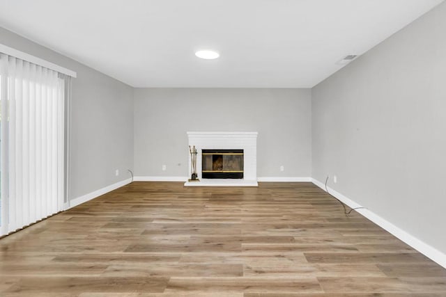 unfurnished living room featuring light hardwood / wood-style flooring