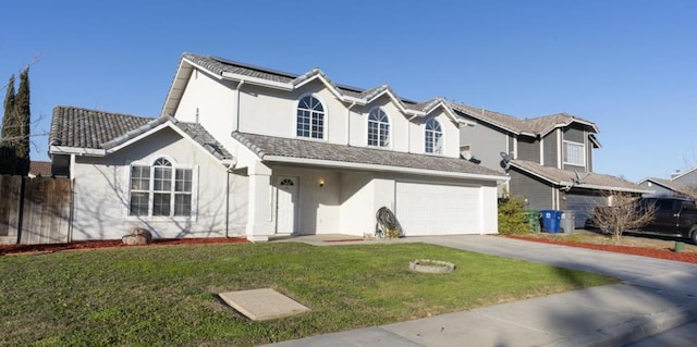 view of front of property with a garage and a front yard