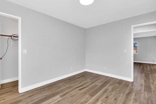 empty room featuring hardwood / wood-style flooring