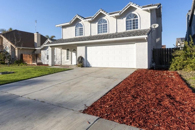 front facade with a garage and a front lawn