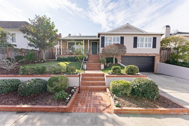 view of front of property with a garage and covered porch