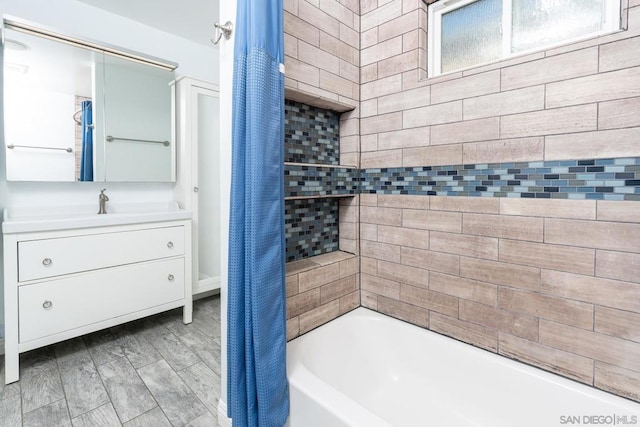 bathroom with shower / tub combo with curtain and vanity