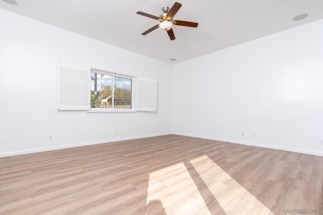 empty room with light hardwood / wood-style floors and ceiling fan