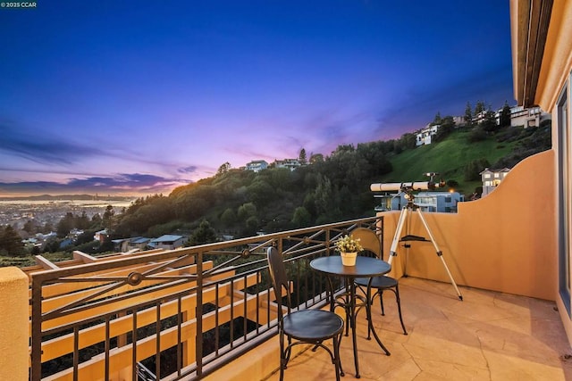 view of balcony at dusk