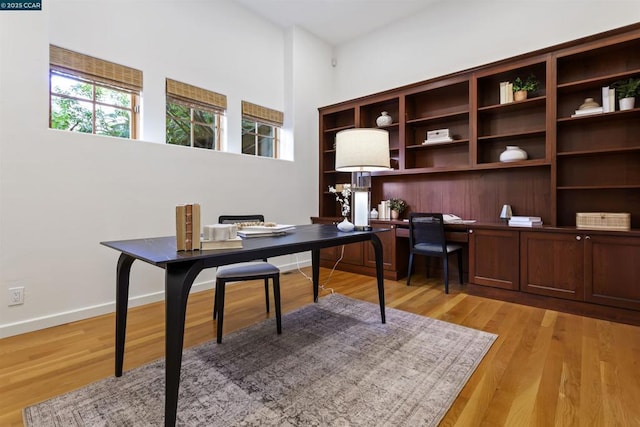 office space with light hardwood / wood-style flooring