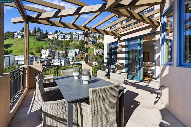 view of patio featuring a balcony and a pergola