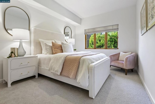 bedroom with light colored carpet