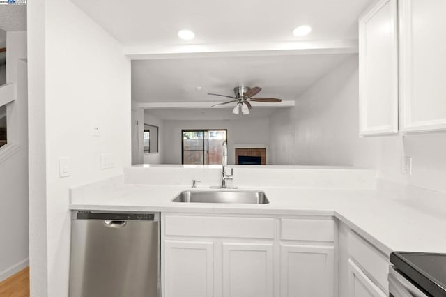 kitchen with ceiling fan, stainless steel dishwasher, sink, and white cabinets