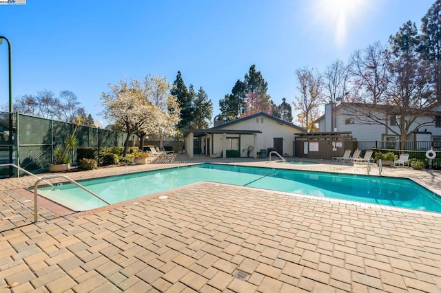 view of swimming pool featuring a pergola and a patio area