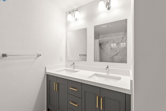 bathroom featuring vanity and a shower