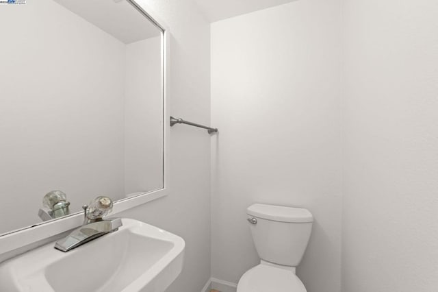 bathroom with toilet and sink